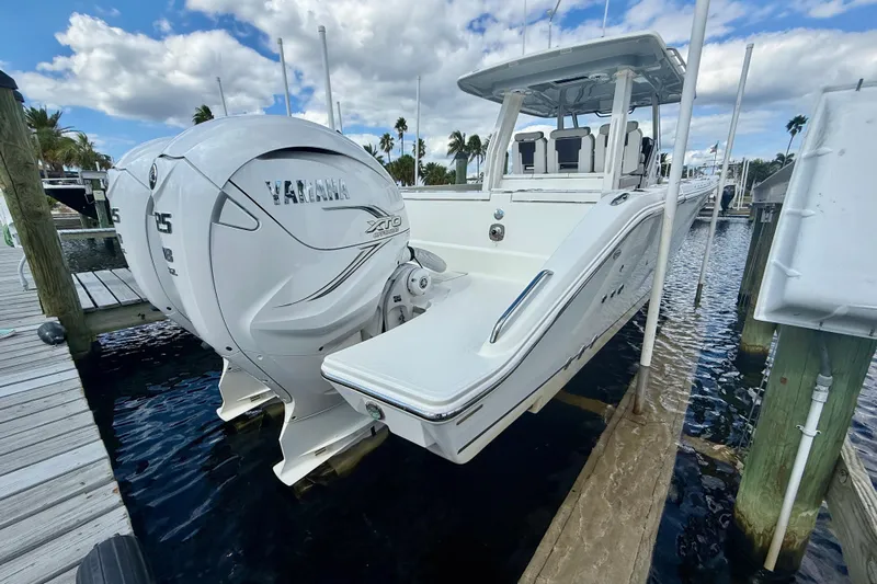  Yacht Photos Pics 2023 Pursuit S 358 Sport boat with Yamaha engines docked at marina.