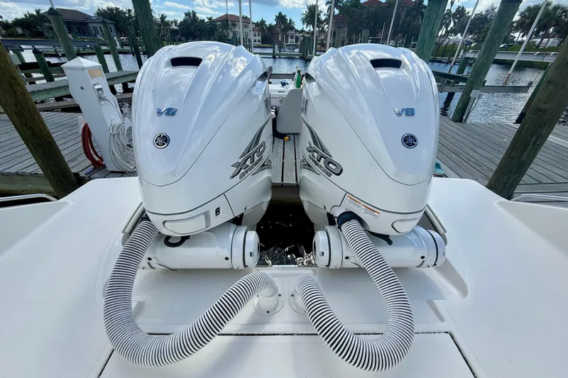  Yacht Photos Pics 2023 Pursuit S 358 Sport boat with twin Yamaha V8 outboard engines at a dock.