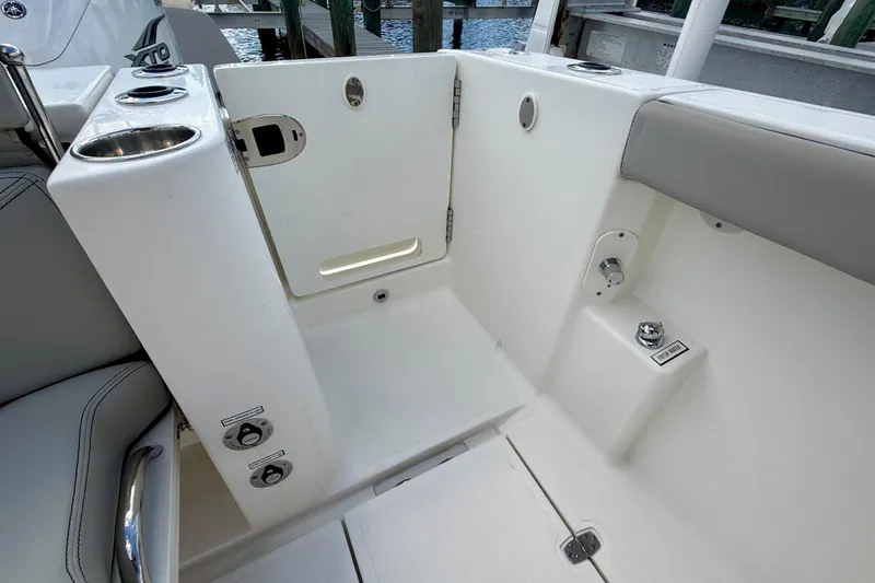  Yacht Photos Pics 2023 Pursuit S 358 Sport boat interior with seating and storage area.