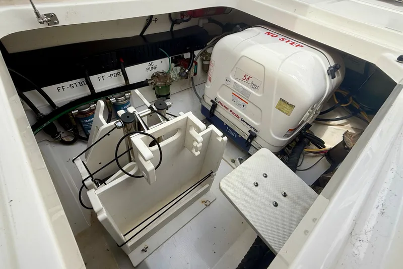  Yacht Photos Pics 2023 Pursuit S 358 Sport boat engine compartment with generator and equipment.