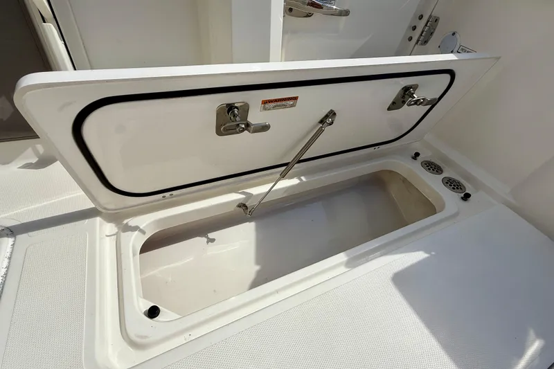  Yacht Photos Pics Open storage compartment on 2023 Pursuit S 358 Sport boat.