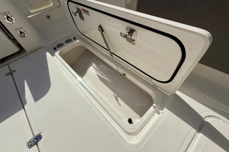  Yacht Photos Pics Open storage compartment on 2023 Pursuit S 358 Sport boat deck.