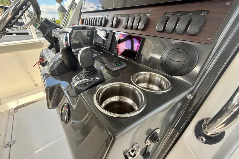  Yacht Photos Pics Control panel of 2023 Pursuit S 358 Sport boat with modern navigation equipment.