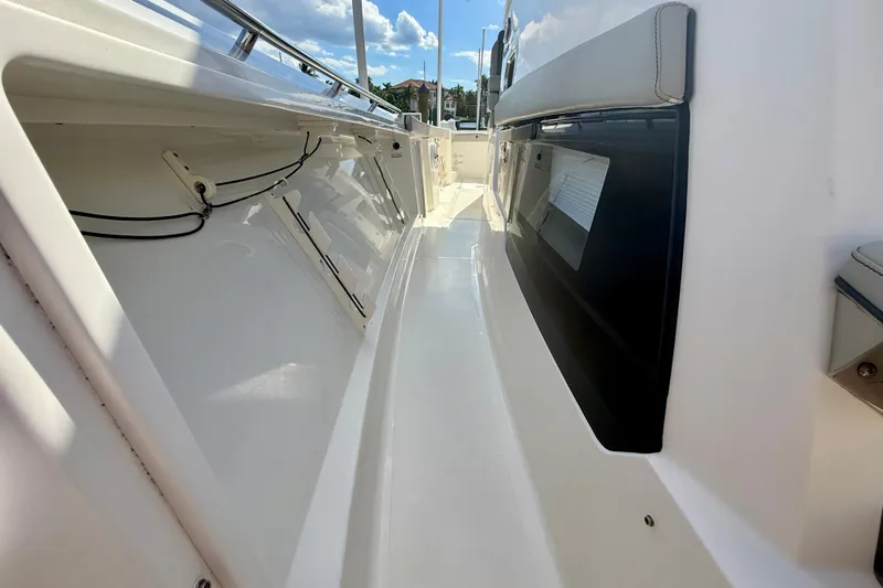  Yacht Photos Pics 2023 Pursuit S 358 Sport boat deck with sleek design and modern features.