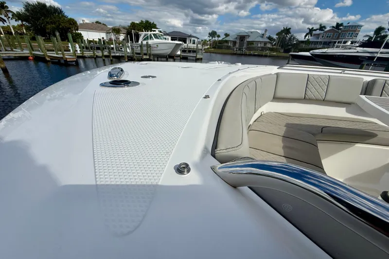  Yacht Photos Pics 2023 Pursuit S 358 Sport boat with sleek design and luxurious seating.