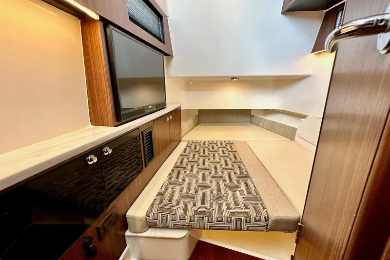  Yacht Photos Pics 2023 Pursuit S 358 Sport cabin interior with modern design and comfortable seating.