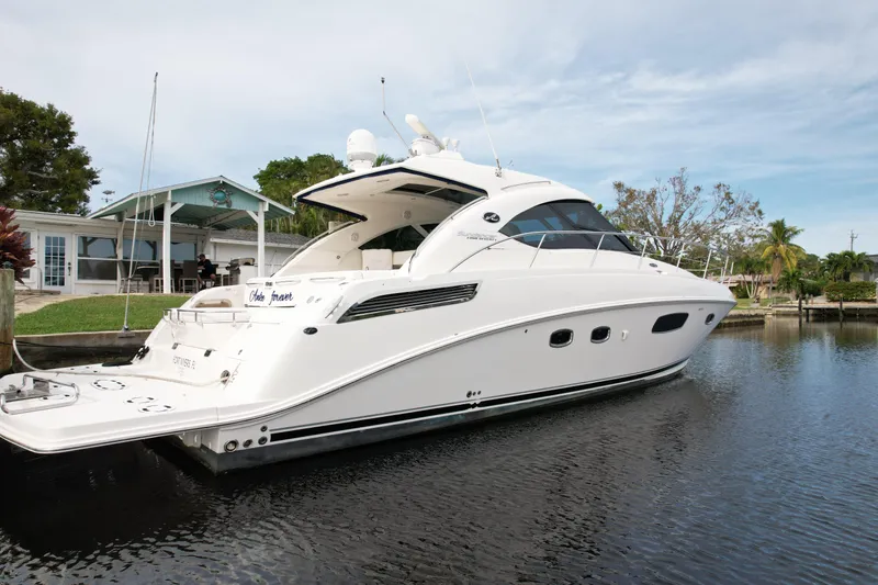 Anke Forever Yacht Photos Pics 2010 Sea Ray 470 Sundancer yacht docked on calm water.