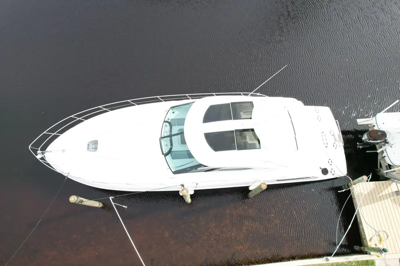 Anke Forever Yacht Photos Pics Aerial view of 2010 Sea Ray 470 Sundancer yacht docked on calm water.