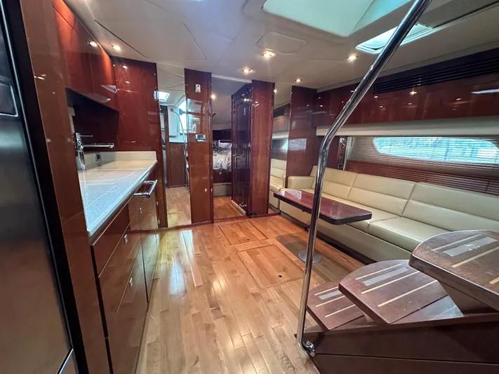 Anke Forever Yacht Photos Pics Luxurious interior of 2010 Sea Ray 470 Sundancer yacht with wood finishes and modern amenities.