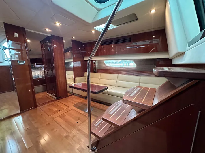 Anke Forever Yacht Photos Pics Luxurious interior of 2010 Sea Ray 470 Sundancer yacht with elegant wood finishes.