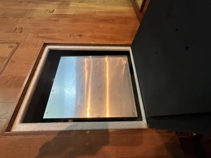 Anke Forever Yacht Photos Pics Hatch on 2010 Sea Ray 470 Sundancer, wooden floor, metal cover.