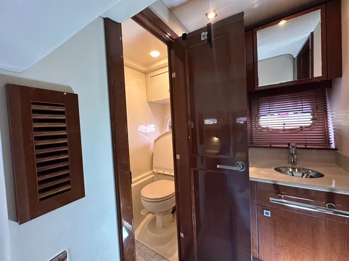 Anke Forever Yacht Photos Pics Luxurious 2010 Sea Ray 470 Sundancer yacht bathroom with wood accents and modern fixtures.