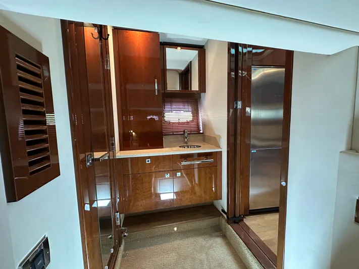 Anke Forever Yacht Photos Pics Luxurious 2010 Sea Ray 470 Sundancer yacht interior with sleek wood cabinetry and modern appliances.