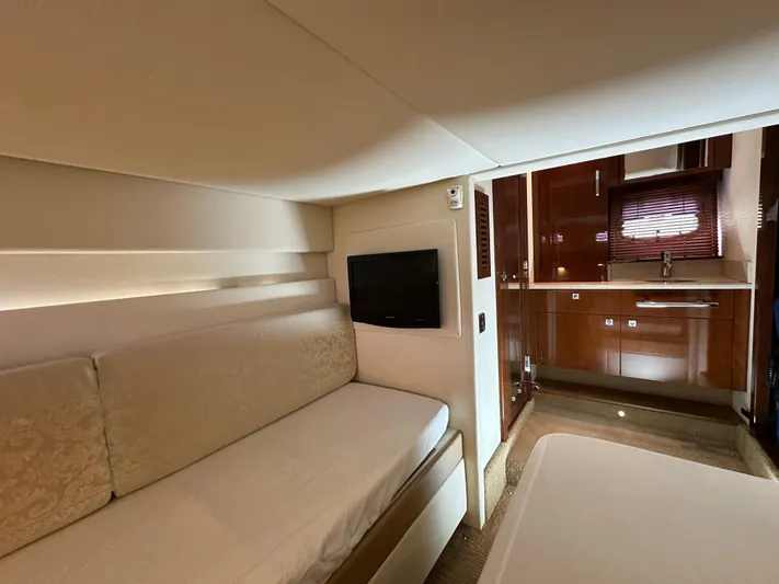 Anke Forever Yacht Photos Pics Interior of 2010 Sea Ray 470 Sundancer yacht with cozy seating and modern kitchenette.