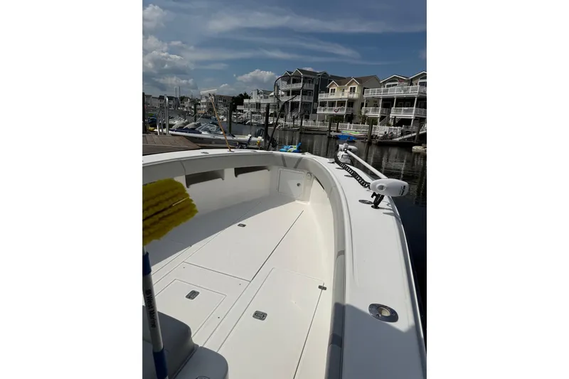  Yacht Photos Pics 2006 SeaVee 340B boat docked in marina with waterfront homes in background.