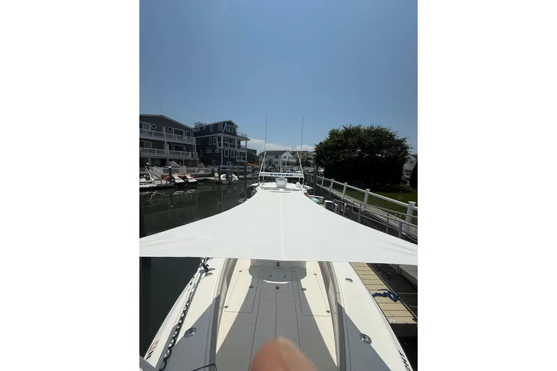  Yacht Photos Pics 2006 SeaVee 340B boat docked in a marina, surrounded by waterfront buildings.