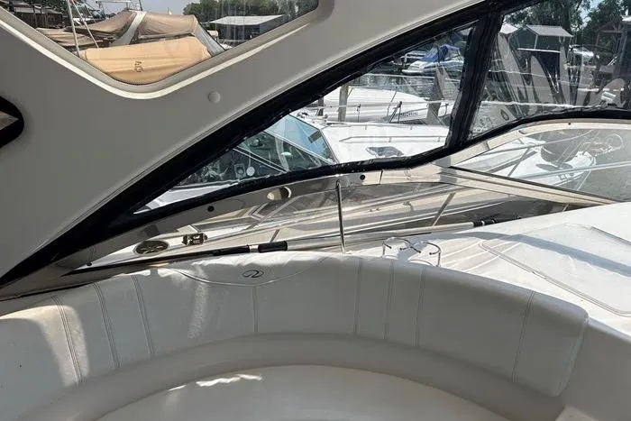 Knot On Call Yacht Photos Pics 2007 Regal Commodore 4060 yacht interior with white seating and marina view.