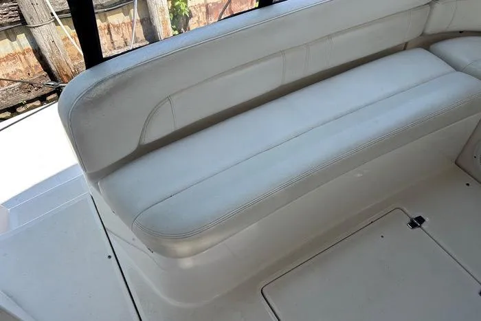 Knot On Call Yacht Photos Pics 2007 Regal Commodore 4060 boat interior with white leather seating.