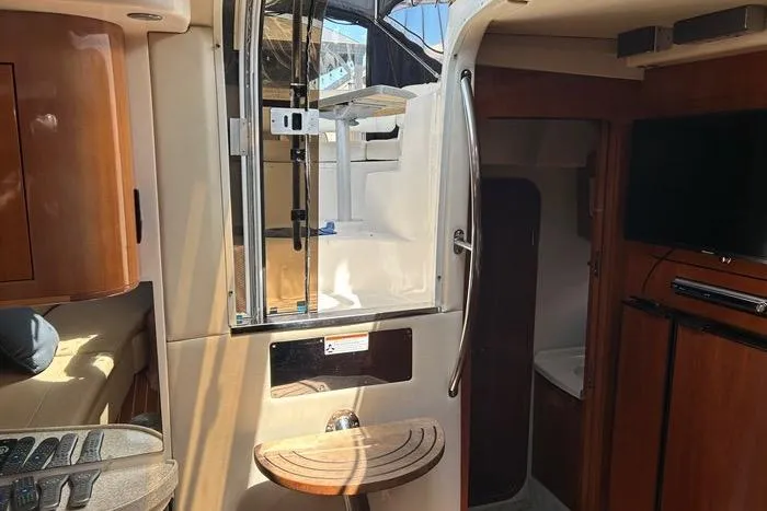 Knot On Call Yacht Photos Pics Interior of 2007 Regal Commodore 4060 yacht, featuring wood accents and modern amenities.