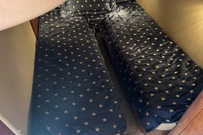 Knot On Call Yacht Photos Pics 2007 Regal Commodore 4060 cabin with star-patterned bedding.