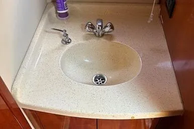 Knot On Call Yacht Photos Pics 2007 Regal Commodore 4060 bathroom sink with faucet and countertop.