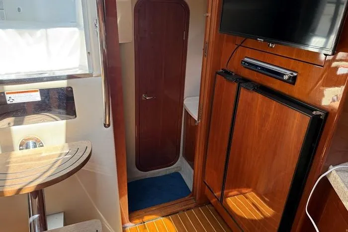 Knot On Call Yacht Photos Pics Interior of 2007 Regal Commodore 4060 yacht with wood finishes and modern amenities.