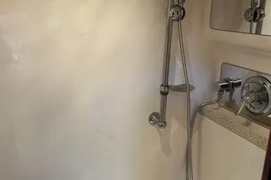 Knot On Call Yacht Photos Pics Shower area in 2007 Regal Commodore 4060 yacht with chrome fixtures.