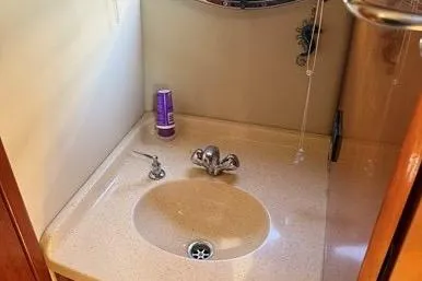 Knot On Call Yacht Photos Pics 2007 Regal Commodore 4060 bathroom sink with faucet and mirror.