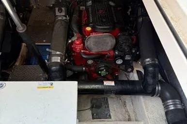 Knot On Call Yacht Photos Pics Engine compartment of a 2007 Regal Commodore 4060 boat, showcasing mechanical components.