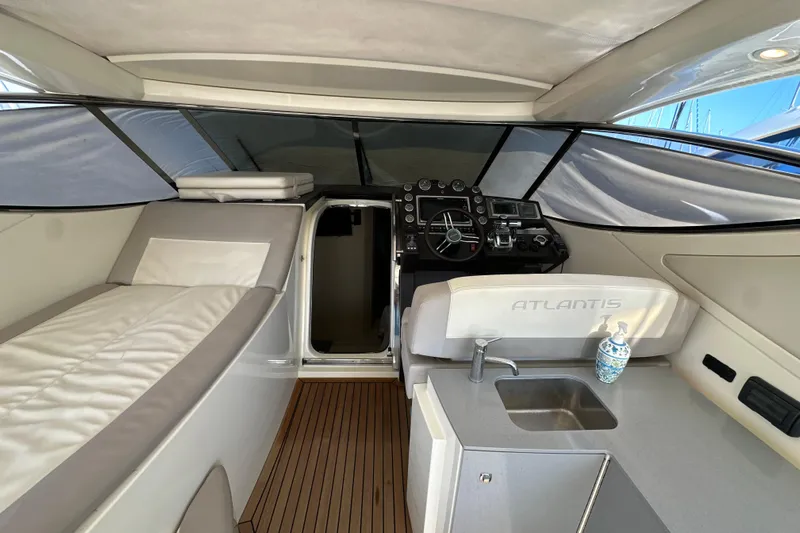  Yacht Photos Pics Interior of 2011 Azimut Atlantis 40 yacht with helm, seating, and kitchenette.