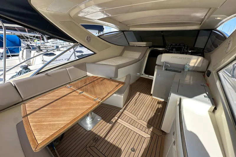  Yacht Photos Pics Luxurious interior of 2011 Azimut Atlantis 40 yacht with wooden table and seating.