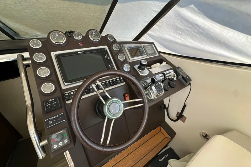  Yacht Photos Pics Cockpit of 2011 Azimut Atlantis 40 yacht with steering wheel and navigation controls.