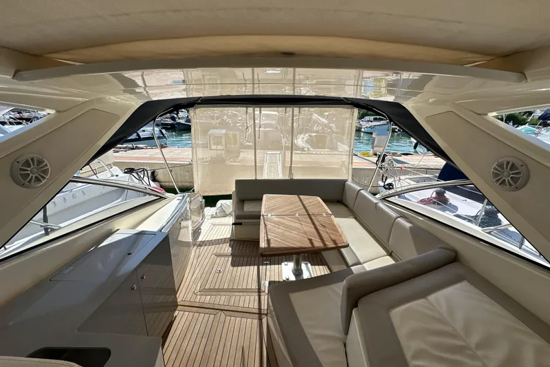  Yacht Photos Pics Luxurious interior of 2011 Azimut Atlantis 40 yacht with elegant seating and wooden table.
