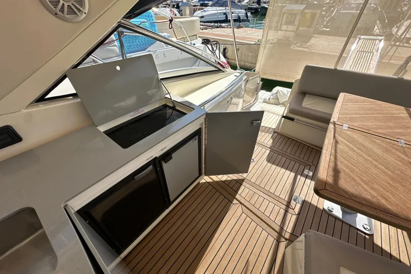  Yacht Photos Pics Azimut Atlantis 40 yacht interior, featuring a kitchenette and seating area, 2011 model.