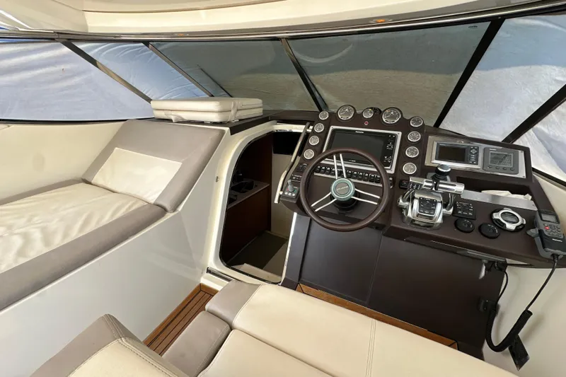  Yacht Photos Pics Helm of 2011 Azimut Atlantis 40 yacht with modern controls and comfortable seating.