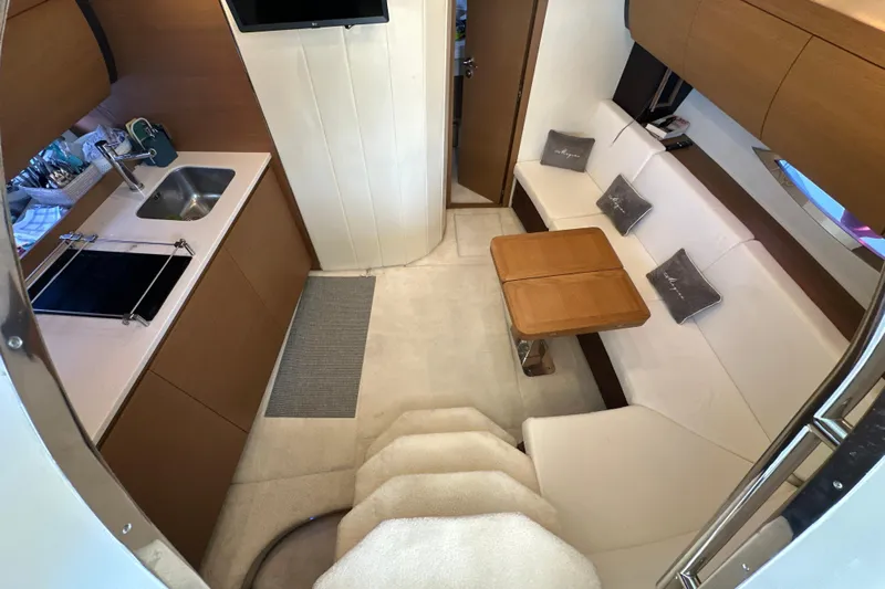  Yacht Photos Pics Luxurious interior of 2011 Azimut Atlantis 40 yacht with kitchen and seating area.