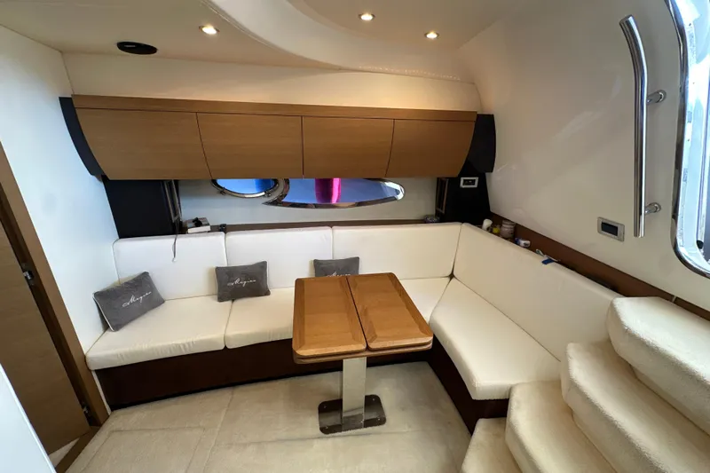  Yacht Photos Pics Luxurious interior of 2011 Azimut Atlantis 40 yacht with elegant seating and wooden accents.