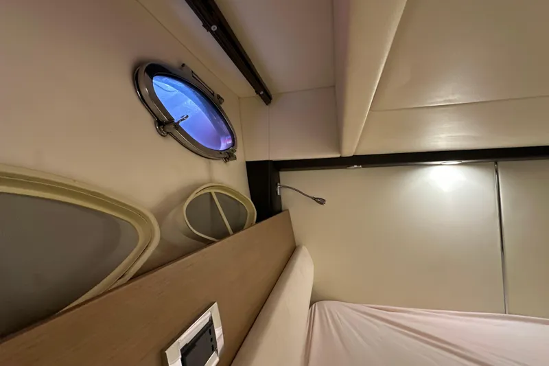  Yacht Photos Pics Interior cabin of 2011 Azimut Atlantis 40 yacht with porthole and modern lighting.