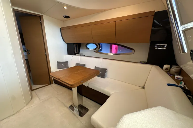  Yacht Photos Pics Luxurious interior of 2011 Azimut Atlantis 40 yacht with elegant seating and wooden table.