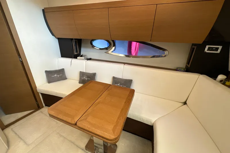  Yacht Photos Pics Luxurious interior of 2011 Azimut Atlantis 40 yacht with elegant seating and wooden table.