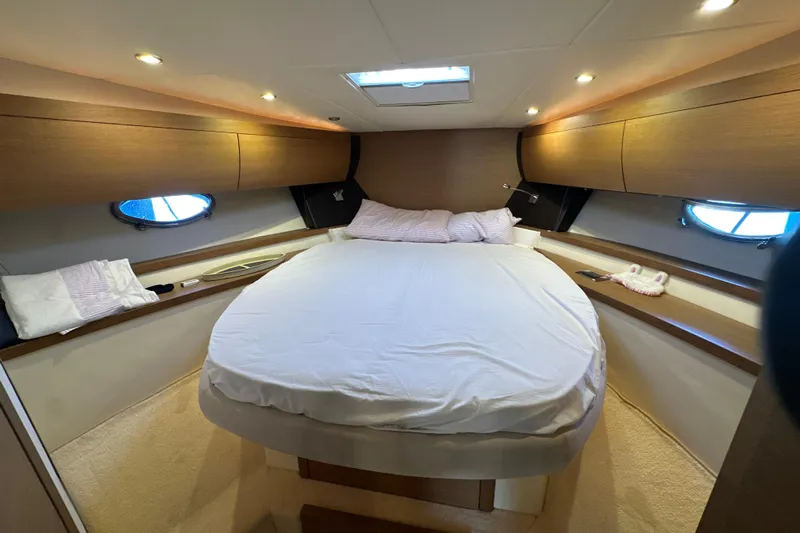  Yacht Photos Pics Luxurious cabin interior of 2011 Azimut Atlantis 40 yacht with cozy bed and ambient lighting.