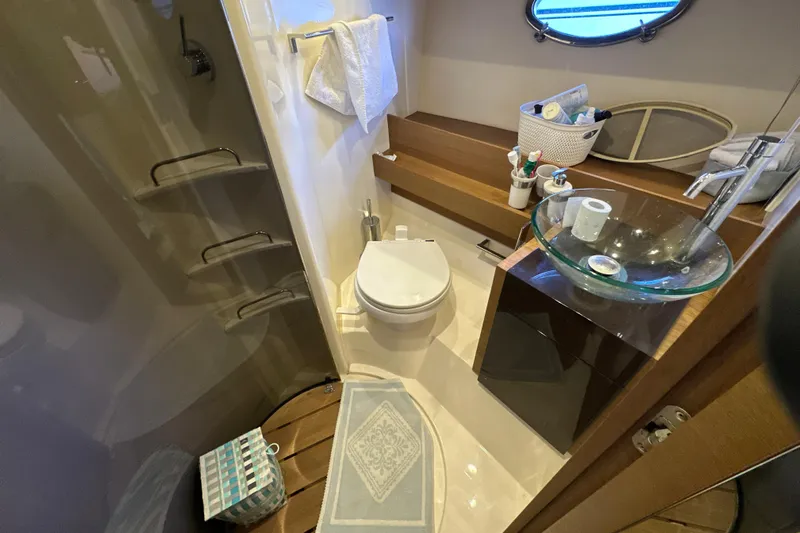 Yacht Photos Pics Luxurious bathroom in 2011 Azimut Atlantis 40 yacht with modern fixtures and elegant design.
