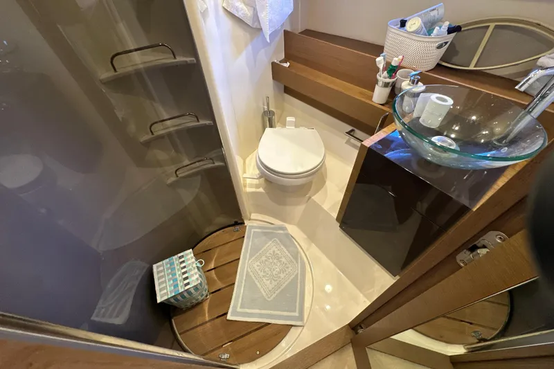  Yacht Photos Pics Bathroom interior of 2011 Azimut Atlantis 40 yacht with modern fixtures and glass sink.