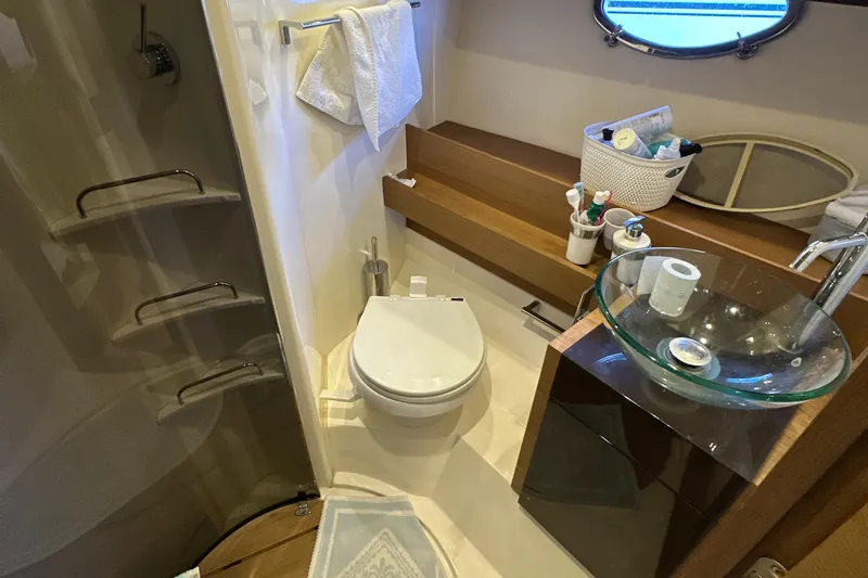  Yacht Photos Pics Luxurious bathroom in 2011 Azimut Atlantis 40 yacht with modern fixtures and glass sink.