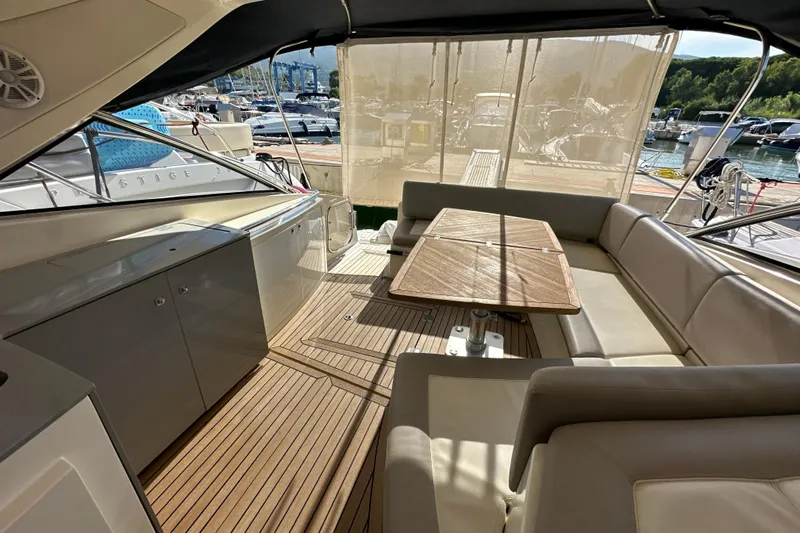  Yacht Photos Pics Luxurious 2011 Azimut Atlantis 40 yacht interior with elegant seating and wooden table.