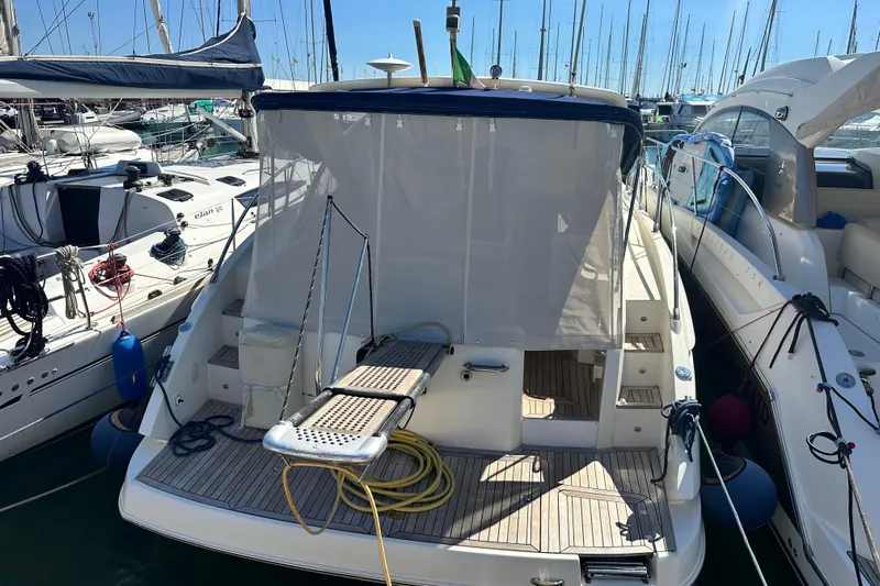  Yacht Photos Pics 2011 Azimut Atlantis 40 yacht docked at marina, rear view with covered deck.