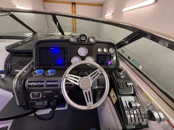  Yacht Photos Pics Cockpit of 2017 Formula 370 FX boat with steering wheel and control panel.