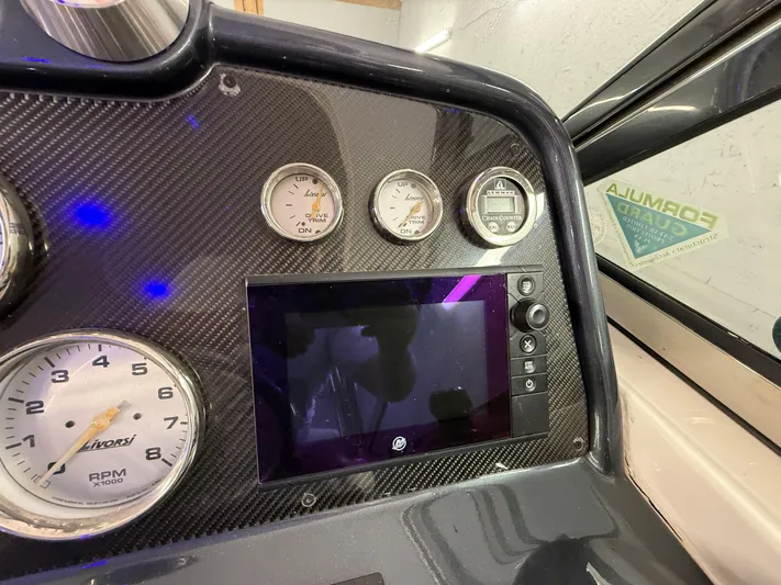 Yacht Photos Pics Dashboard of a 2017 Formula 370 FX boat with gauges and a digital display.