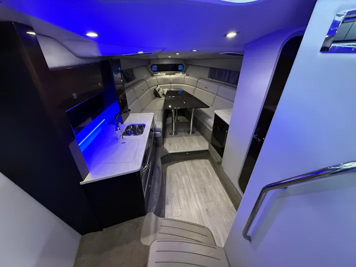 Yacht Photos Pics Luxurious interior of 2017 Formula 370 FX boat with modern kitchen and seating area.