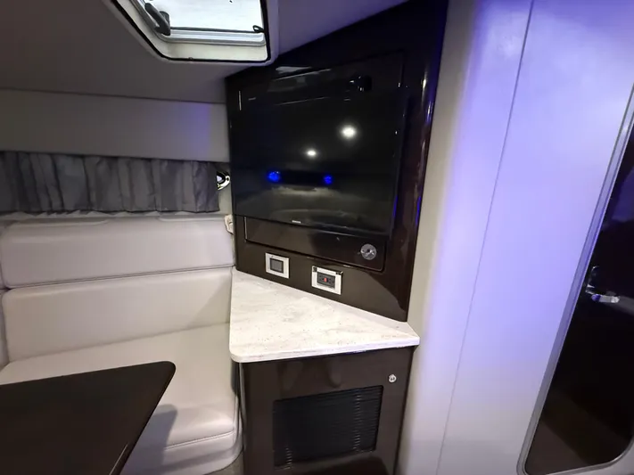  Yacht Photos Pics Interior of 2017 Formula 370 FX boat with TV and seating area.